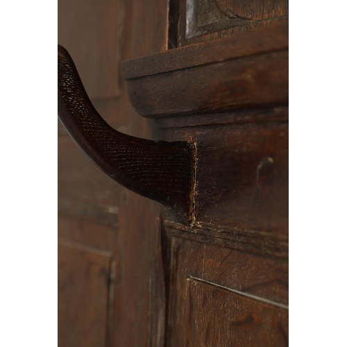 529 - A LARGE CARVED OAK COUNTRY HOUSE HALLSTAND. with a shaped cornice and panel back, carved Lion masks ... 