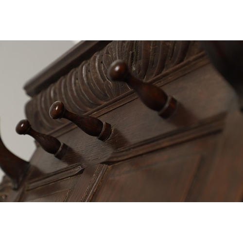 529 - A LARGE CARVED OAK COUNTRY HOUSE HALLSTAND. with a shaped cornice and panel back, carved Lion masks ... 