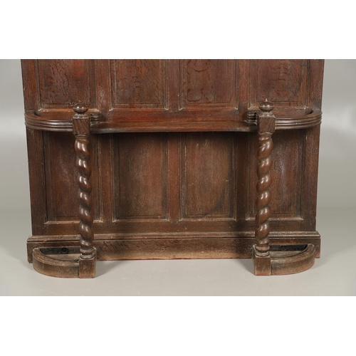 529 - A LARGE CARVED OAK COUNTRY HOUSE HALLSTAND. with a shaped cornice and panel back, carved Lion masks ... 