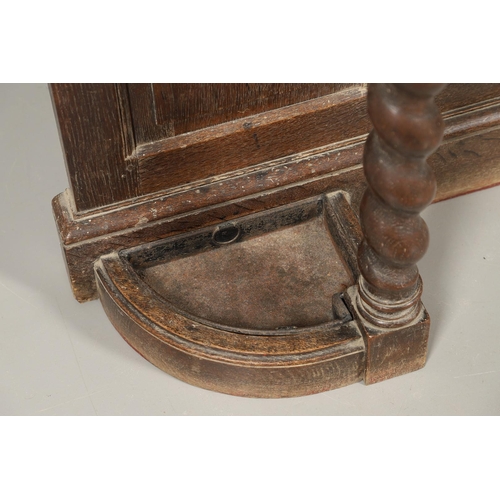 529 - A LARGE CARVED OAK COUNTRY HOUSE HALLSTAND. with a shaped cornice and panel back, carved Lion masks ... 