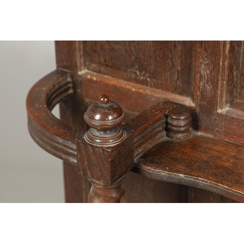 529 - A LARGE CARVED OAK COUNTRY HOUSE HALLSTAND. with a shaped cornice and panel back, carved Lion masks ... 