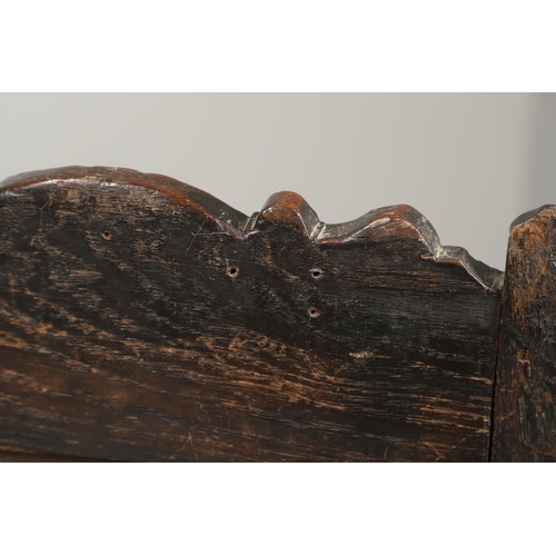 530 - A 17TH CENTURY OAK WAINSCOTT CHAIR. the back with relief-carved frieze and panel of multiple flowers... 