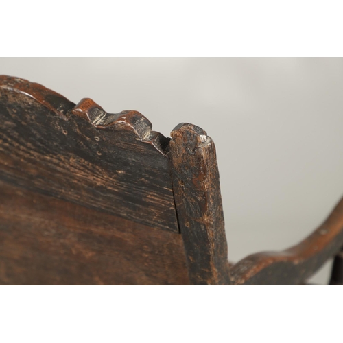 530 - A 17TH CENTURY OAK WAINSCOTT CHAIR. the back with relief-carved frieze and panel of multiple flowers... 