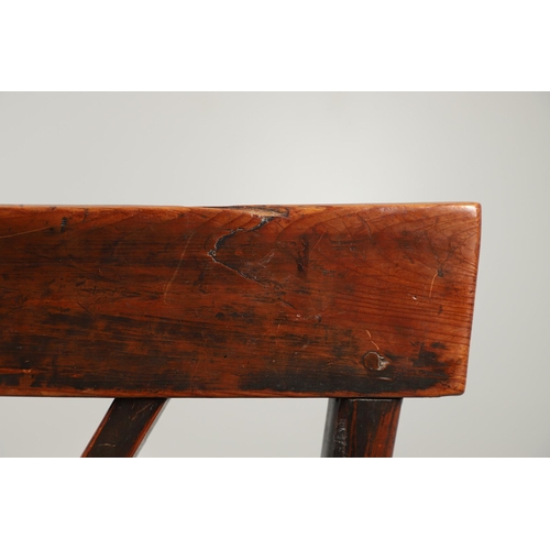 531 - A YEW AND ELM WINDSOR ELBOW CHAIR. early 19th century, Buckingham or Oxford, the cross and roundel b... 