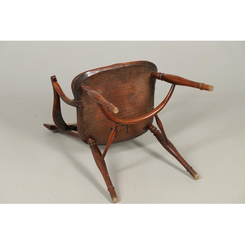 531 - A YEW AND ELM WINDSOR ELBOW CHAIR. early 19th century, Buckingham or Oxford, the cross and roundel b... 