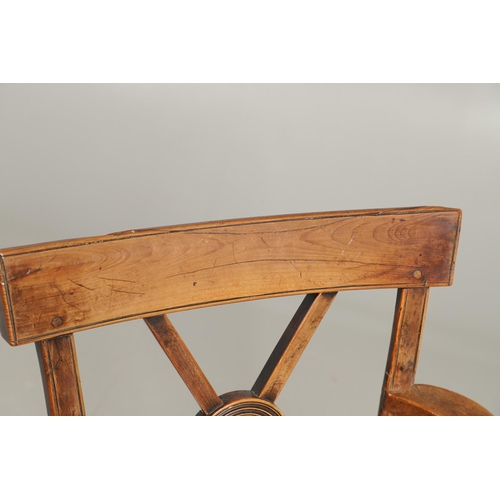 531 - A YEW AND ELM WINDSOR ELBOW CHAIR. early 19th century, Buckingham or Oxford, the cross and roundel b... 