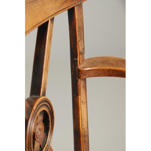 531 - A YEW AND ELM WINDSOR ELBOW CHAIR. early 19th century, Buckingham or Oxford, the cross and roundel b... 