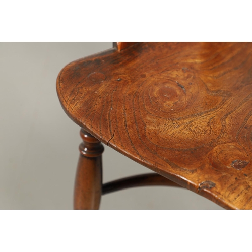 531 - A YEW AND ELM WINDSOR ELBOW CHAIR. early 19th century, Buckingham or Oxford, the cross and roundel b... 