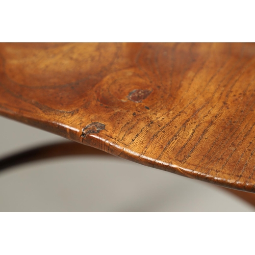 531 - A YEW AND ELM WINDSOR ELBOW CHAIR. early 19th century, Buckingham or Oxford, the cross and roundel b... 