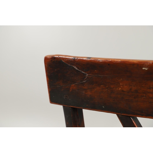 531 - A YEW AND ELM WINDSOR ELBOW CHAIR. early 19th century, Buckingham or Oxford, the cross and roundel b... 