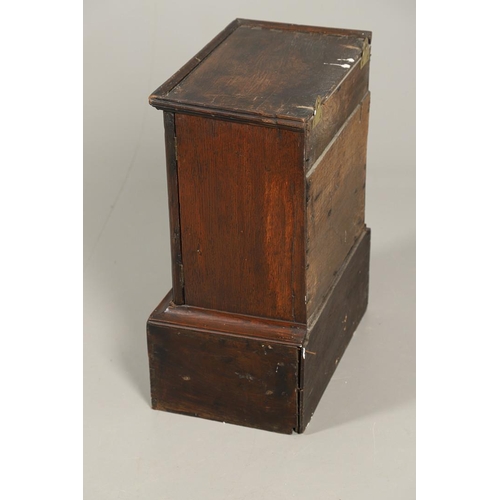 532 - A 17TH CENTURY OAK SPICE CUPBOARD. the panelled door revealing a pigeon hole interior and seven smal... 