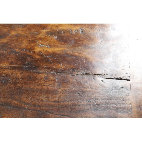 533 - AN EARLY 20TH CENTURY OAK AND ELM REFECTORY TABLE. the elm five plank top upon turned and block supp... 