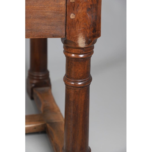 533 - AN EARLY 20TH CENTURY OAK AND ELM REFECTORY TABLE. the elm five plank top upon turned and block supp... 