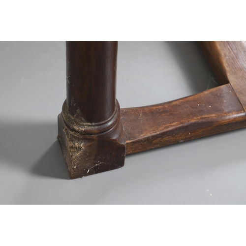 533 - AN EARLY 20TH CENTURY OAK AND ELM REFECTORY TABLE. the elm five plank top upon turned and block supp... 