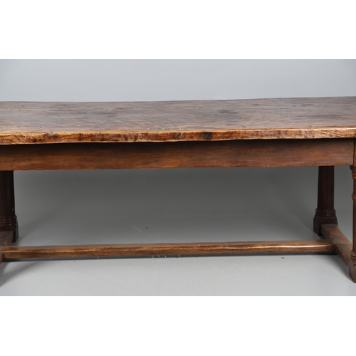 533 - AN EARLY 20TH CENTURY OAK AND ELM REFECTORY TABLE. the elm five plank top upon turned and block supp... 