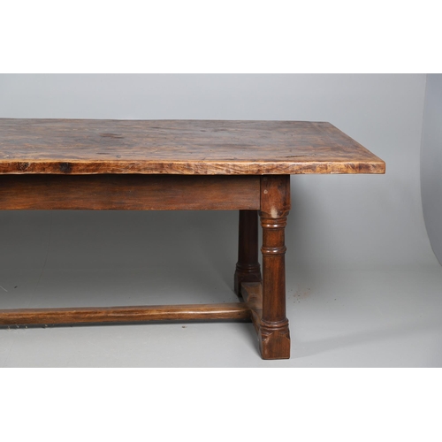 533 - AN EARLY 20TH CENTURY OAK AND ELM REFECTORY TABLE. the elm five plank top upon turned and block supp... 