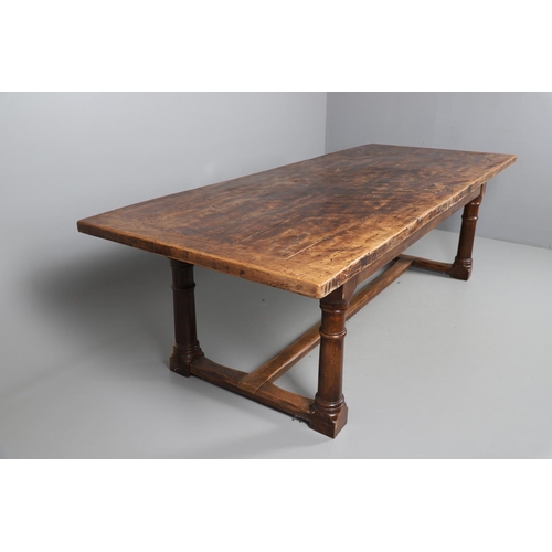 533 - AN EARLY 20TH CENTURY OAK AND ELM REFECTORY TABLE. the elm five plank top upon turned and block supp... 