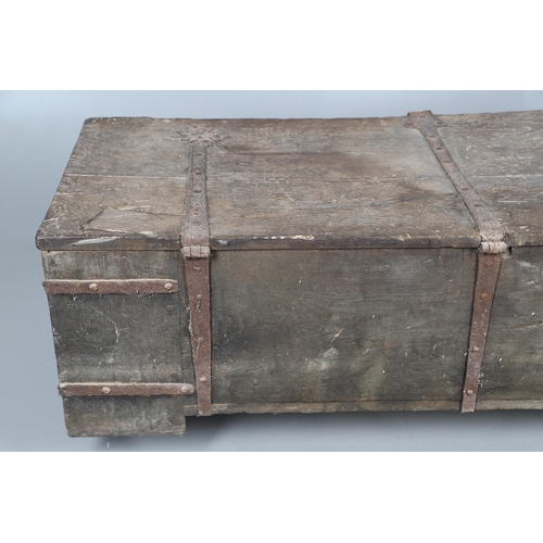 534 - A SUBSTANTIAL ANTIQUE OAK AND IRON STRAPWORK CHEST. the two plank lid and body bound with ornate str... 