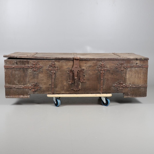 534 - A SUBSTANTIAL ANTIQUE OAK AND IRON STRAPWORK CHEST. the two plank lid and body bound with ornate str... 