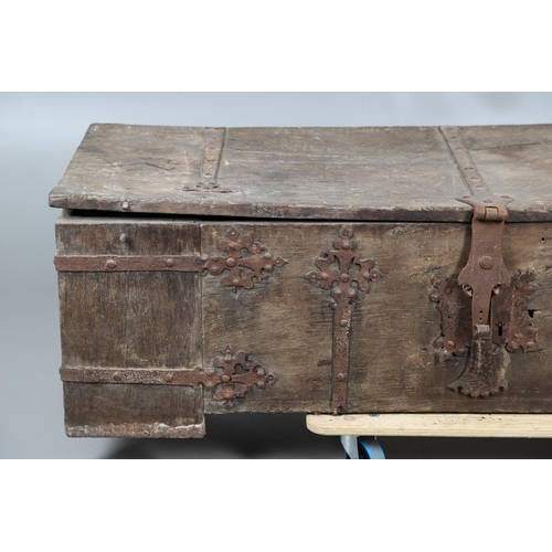 534 - A SUBSTANTIAL ANTIQUE OAK AND IRON STRAPWORK CHEST. the two plank lid and body bound with ornate str... 