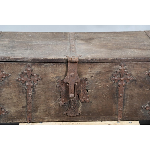 534 - A SUBSTANTIAL ANTIQUE OAK AND IRON STRAPWORK CHEST. the two plank lid and body bound with ornate str... 