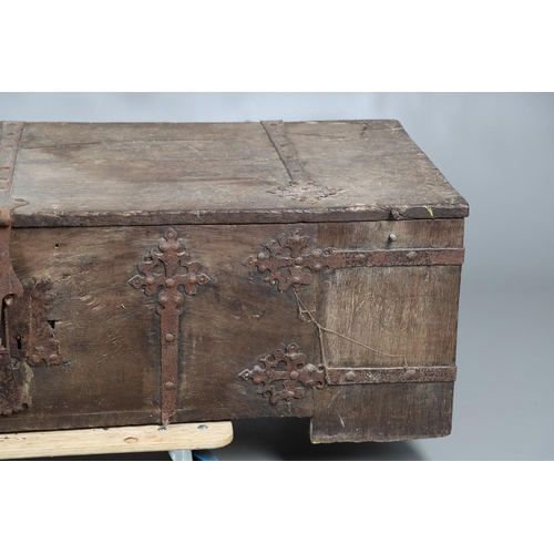 534 - A SUBSTANTIAL ANTIQUE OAK AND IRON STRAPWORK CHEST. the two plank lid and body bound with ornate str... 