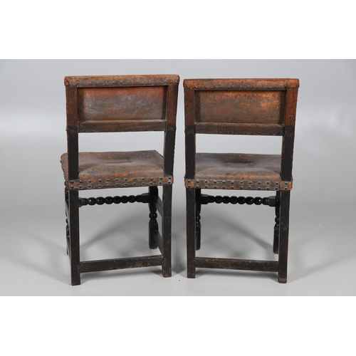 535 - A PAIR OF 17TH CENTURY OAK BACKSTOOLS. with original brass studded leather upholstery on turned and ... 