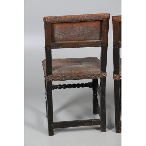 535 - A PAIR OF 17TH CENTURY OAK BACKSTOOLS. with original brass studded leather upholstery on turned and ... 