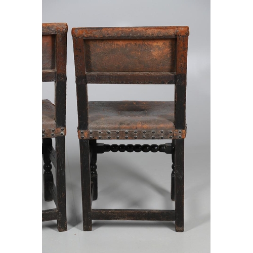 535 - A PAIR OF 17TH CENTURY OAK BACKSTOOLS. with original brass studded leather upholstery on turned and ... 