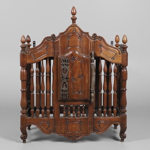 536 - AN ANTIQUE FRENCH FRUITWOOD FOOD HUTCH. open turned spindles joined by a scroll carved apron, fitted... 