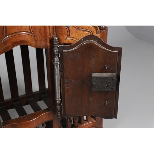 536 - AN ANTIQUE FRENCH FRUITWOOD FOOD HUTCH. open turned spindles joined by a scroll carved apron, fitted... 