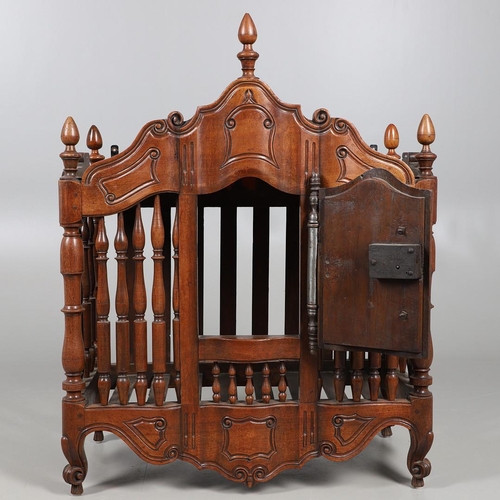 536 - AN ANTIQUE FRENCH FRUITWOOD FOOD HUTCH. open turned spindles joined by a scroll carved apron, fitted... 