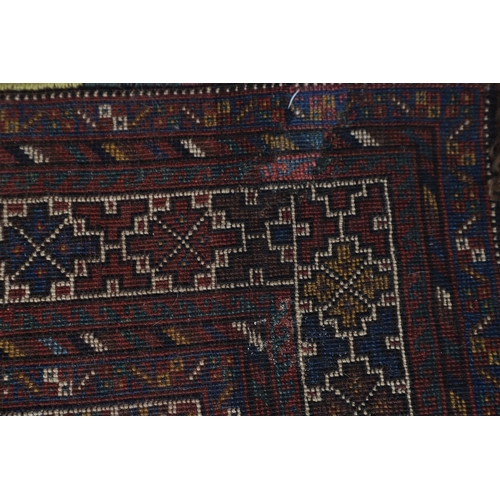 540 - A KHAMSEH RUG, EARLY 20TH CENTURY. the field of tribal devices around three ivory diamond medallions... 