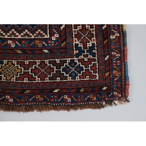 540 - A KHAMSEH RUG, EARLY 20TH CENTURY. the field of tribal devices around three ivory diamond medallions... 