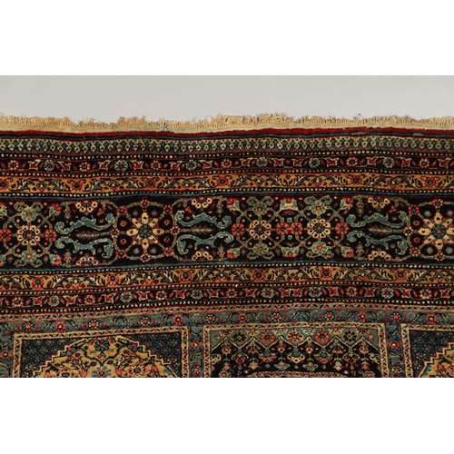 542 - A MASHAD RUG, NORTH EAST KHORASAN, CIRCA 1920. the compartmentalised floral field enclosed by flower... 