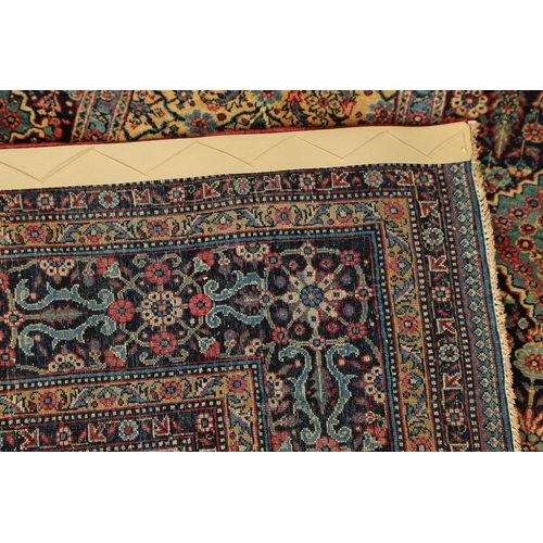 542 - A MASHAD RUG, NORTH EAST KHORASAN, CIRCA 1920. the compartmentalised floral field enclosed by flower... 