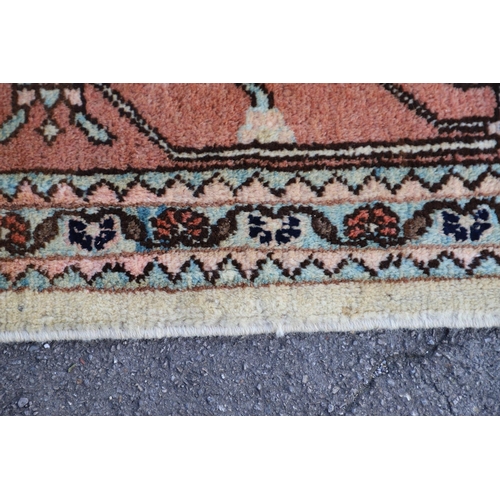 544 - A WEST ANATOLIAN CARPET OF UNUSUAL SIZE, CIRCA 1980. the cream field with columns of heraldic motifs... 