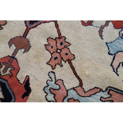 544 - A WEST ANATOLIAN CARPET OF UNUSUAL SIZE, CIRCA 1980. the cream field with columns of heraldic motifs... 