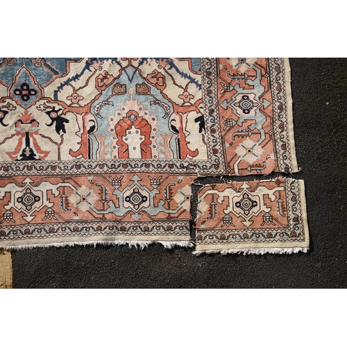 544 - A WEST ANATOLIAN CARPET OF UNUSUAL SIZE, CIRCA 1980. the cream field with columns of heraldic motifs... 