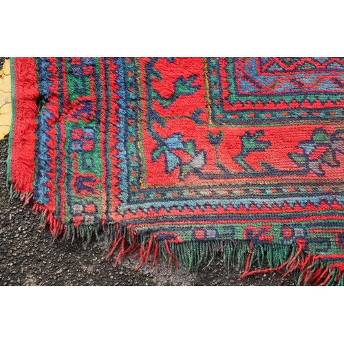 548 - A MAPLES 'TURKEY' CARPET, WEST ANATOLIA, CIRCA 1920. the tomato red field centred by a hexagonal dia... 