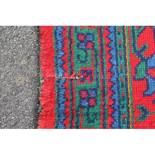 548 - A MAPLES 'TURKEY' CARPET, WEST ANATOLIA, CIRCA 1920. the tomato red field centred by a hexagonal dia... 