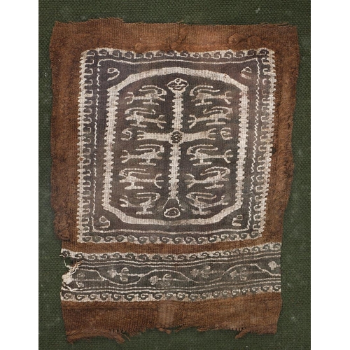 553 - EARLY COPTIC TEXTILE - FOLIO FINE ART LABEL. A fragment of a woven Coptic textile, possibly 5th/6th ... 