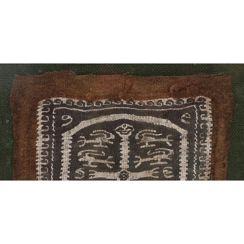 553 - EARLY COPTIC TEXTILE - FOLIO FINE ART LABEL. A fragment of a woven Coptic textile, possibly 5th/6th ... 