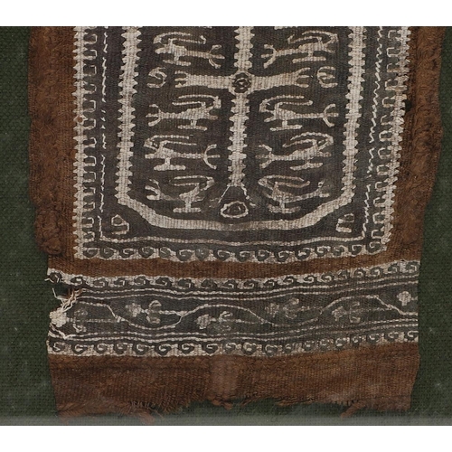 553 - EARLY COPTIC TEXTILE - FOLIO FINE ART LABEL. A fragment of a woven Coptic textile, possibly 5th/6th ... 