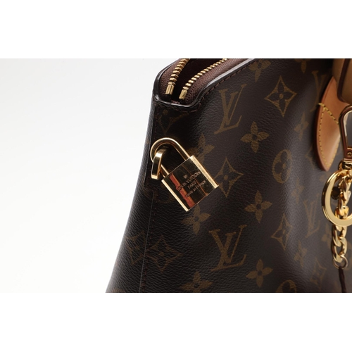 554 - LOUIS VUITTON 'LOCK IT' HANDBAG. A monogrammed canvas and leather handbag, with a brass lock on one ... 