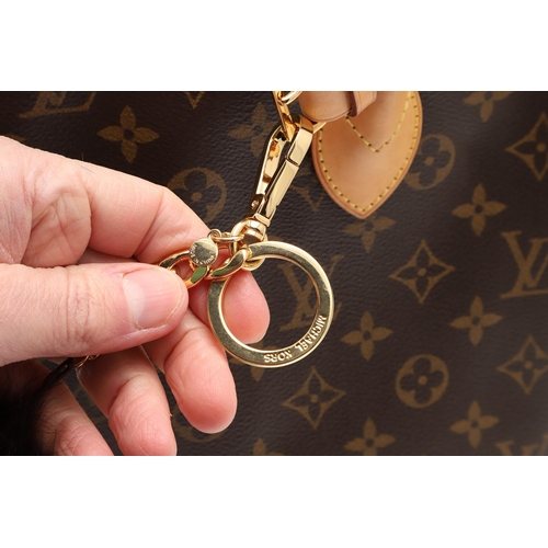 554 - LOUIS VUITTON 'LOCK IT' HANDBAG. A monogrammed canvas and leather handbag, with a brass lock on one ... 