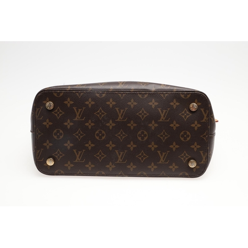 554 - LOUIS VUITTON 'LOCK IT' HANDBAG. A monogrammed canvas and leather handbag, with a brass lock on one ... 