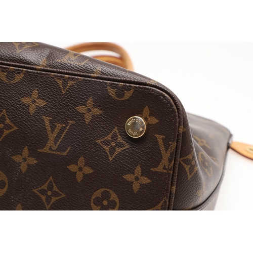 554 - LOUIS VUITTON 'LOCK IT' HANDBAG. A monogrammed canvas and leather handbag, with a brass lock on one ... 