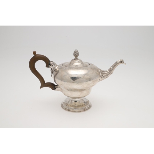 98 - A GEORGE III SILVER TEA POT. of inverted baluster form, with a scroll handle, engraved decoration ar... 