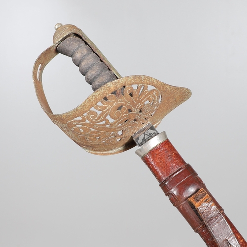 103 - A GEORGE V 1897 PATTERN SERGEANTS SWORD AND SCABBARD. With an 82 cm tapering, pointed blade with etc... 